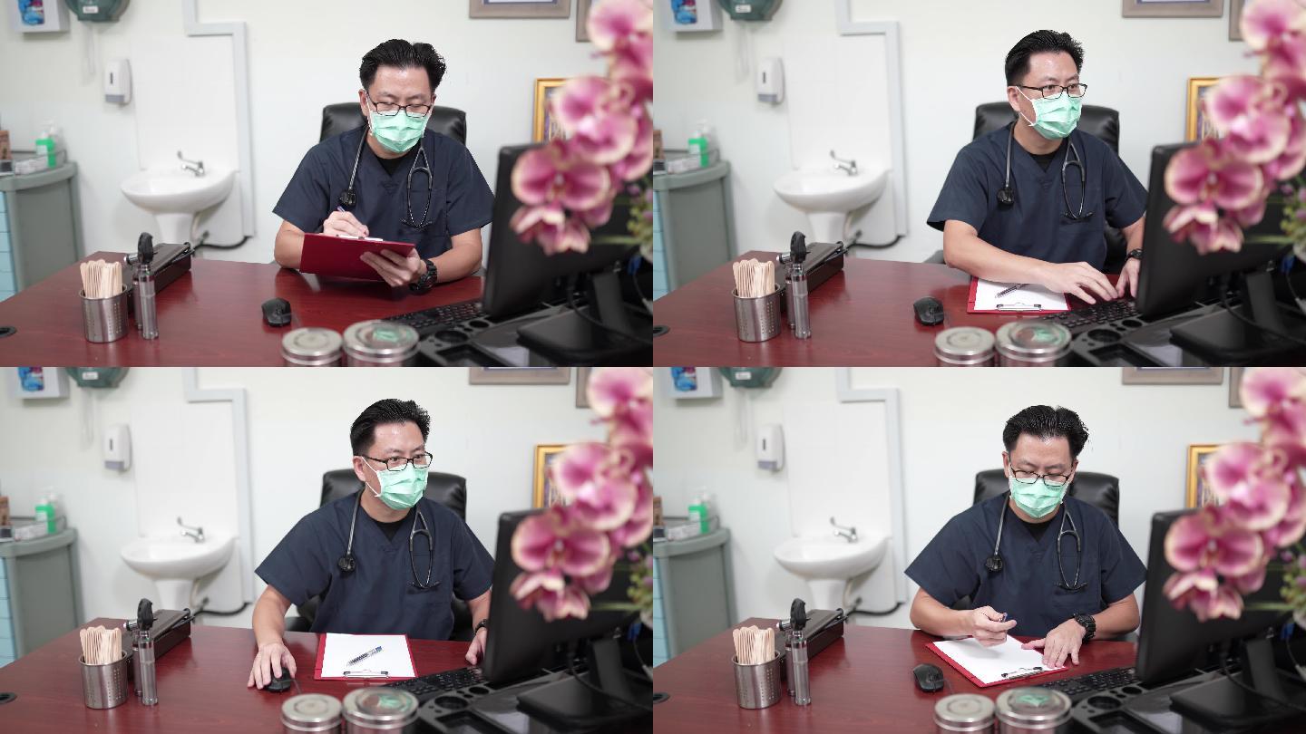 男性医生戴口罩在台式电脑上查看病历