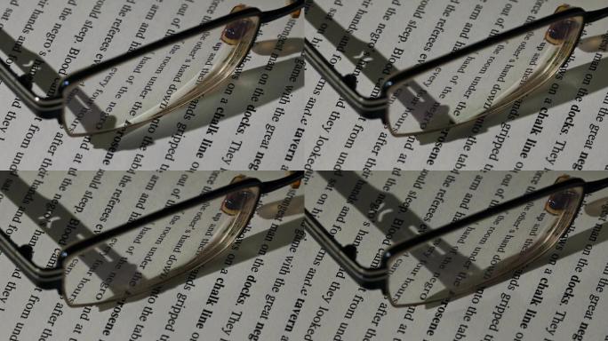 英文书上的眼镜光影移动