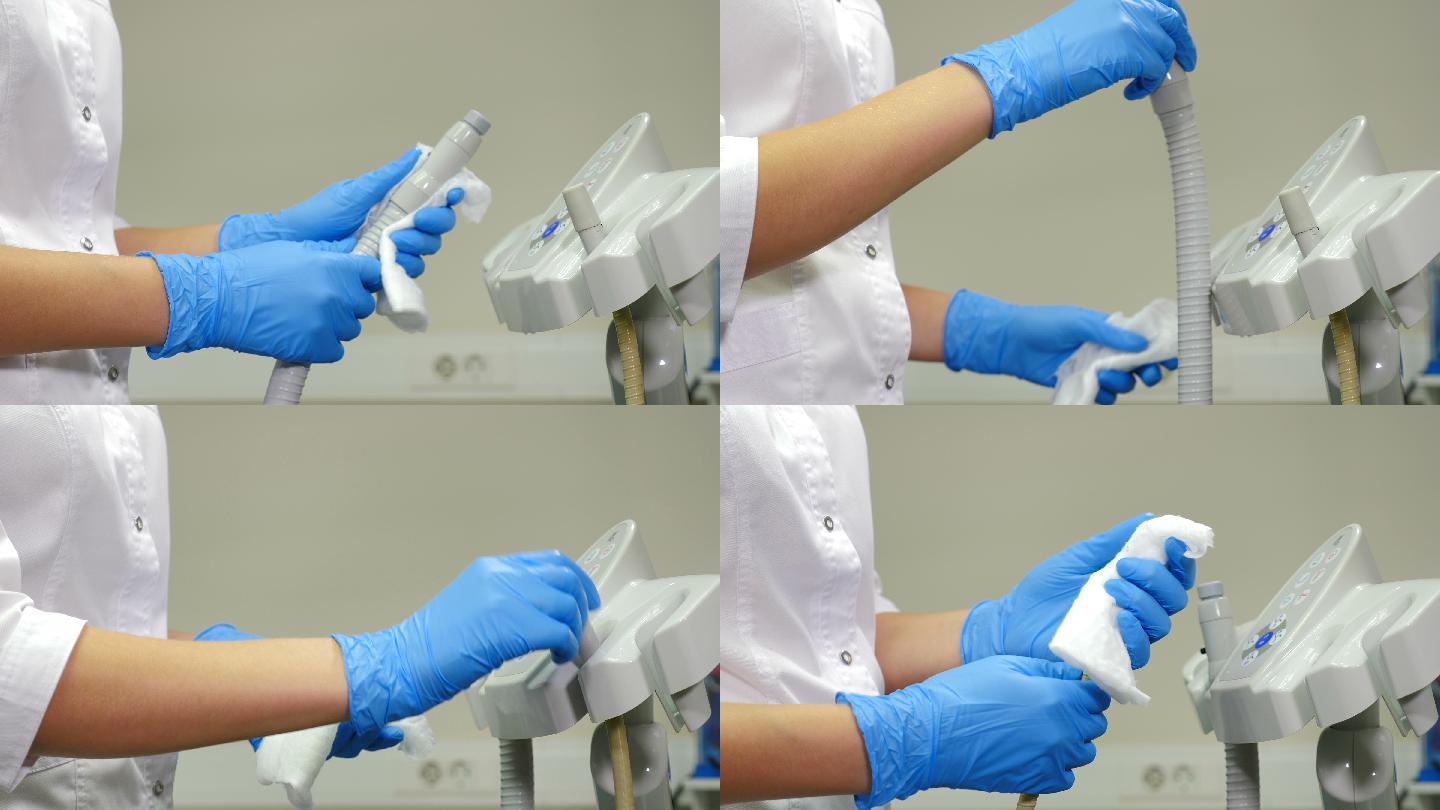 牙科助手用消毒液擦拭医疗设备和工具
