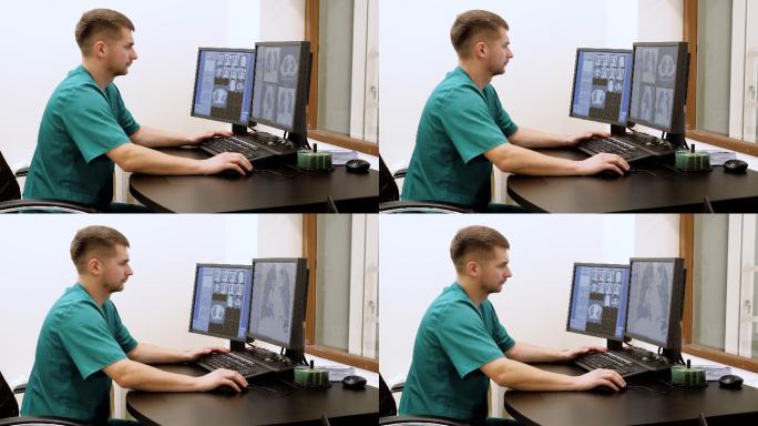 医生在电脑屏幕上查看病人的扫描结果