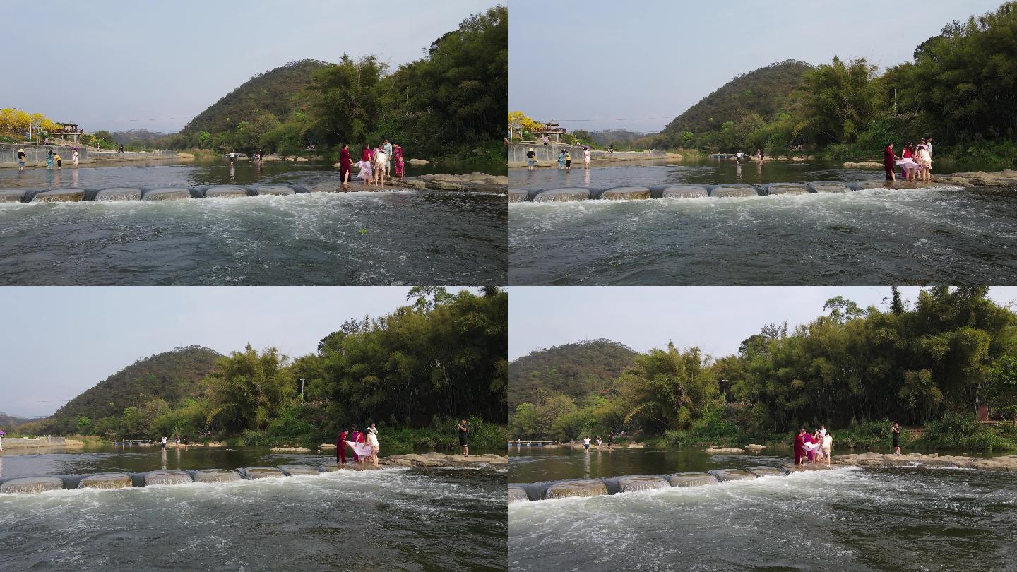 游客过淌水墩航拍素材