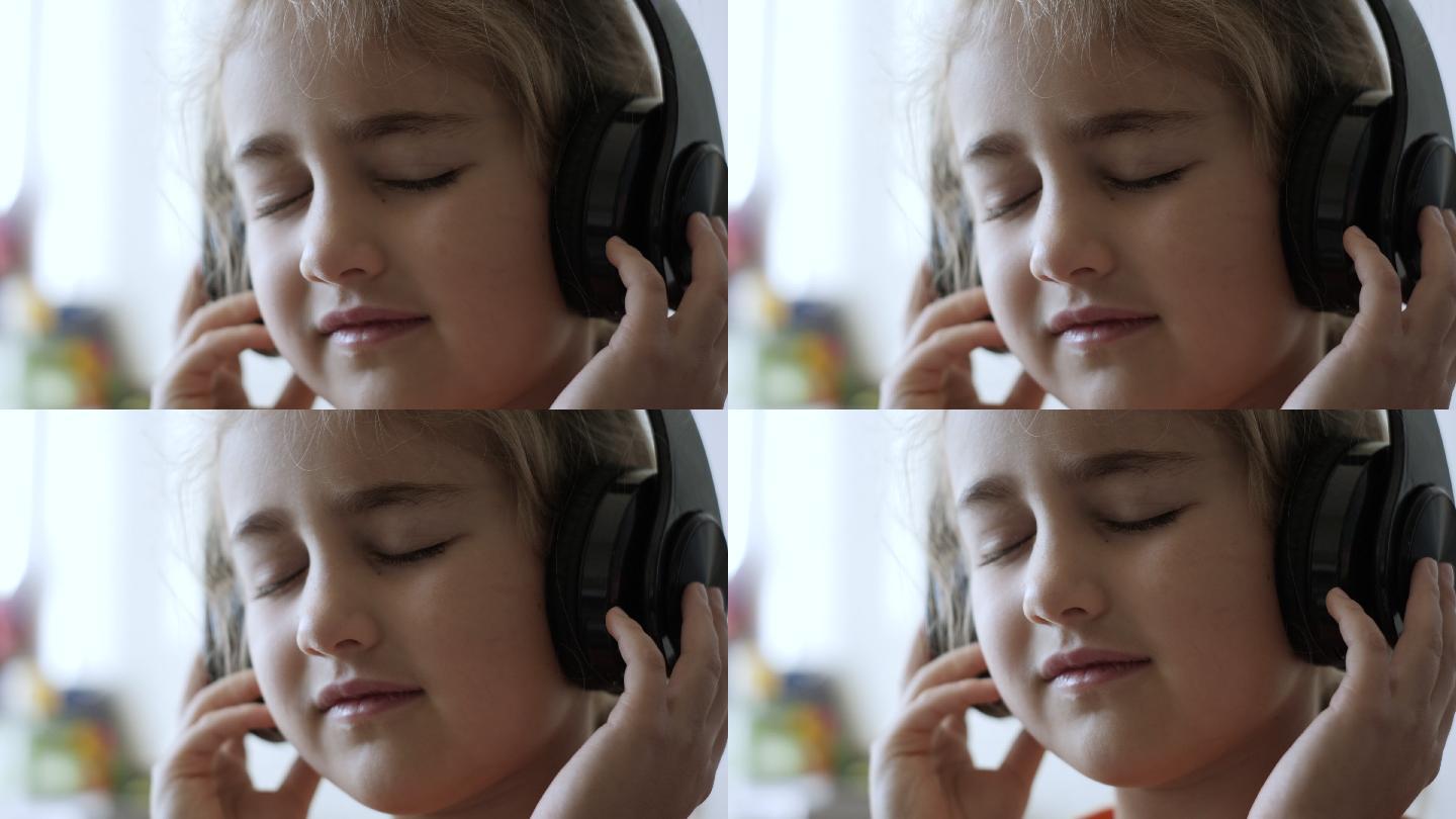 戴着耳机听音乐的可爱小女孩的肖像