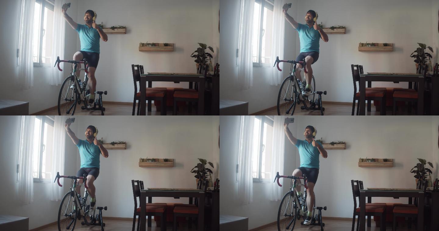男子在家里骑着健身自行车训练时自拍。