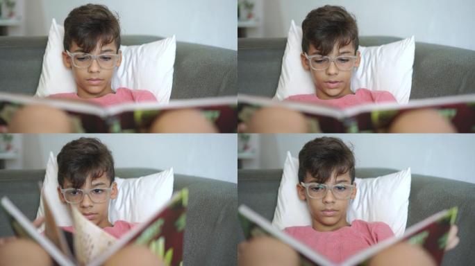 男孩在沙发上看书