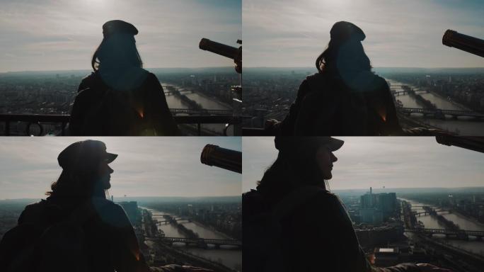 女子在巴黎埃菲尔铁塔上观看美丽的日落