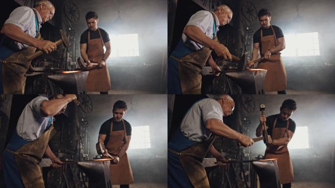 老铁匠和年轻铁匠用锤子敲打金属片