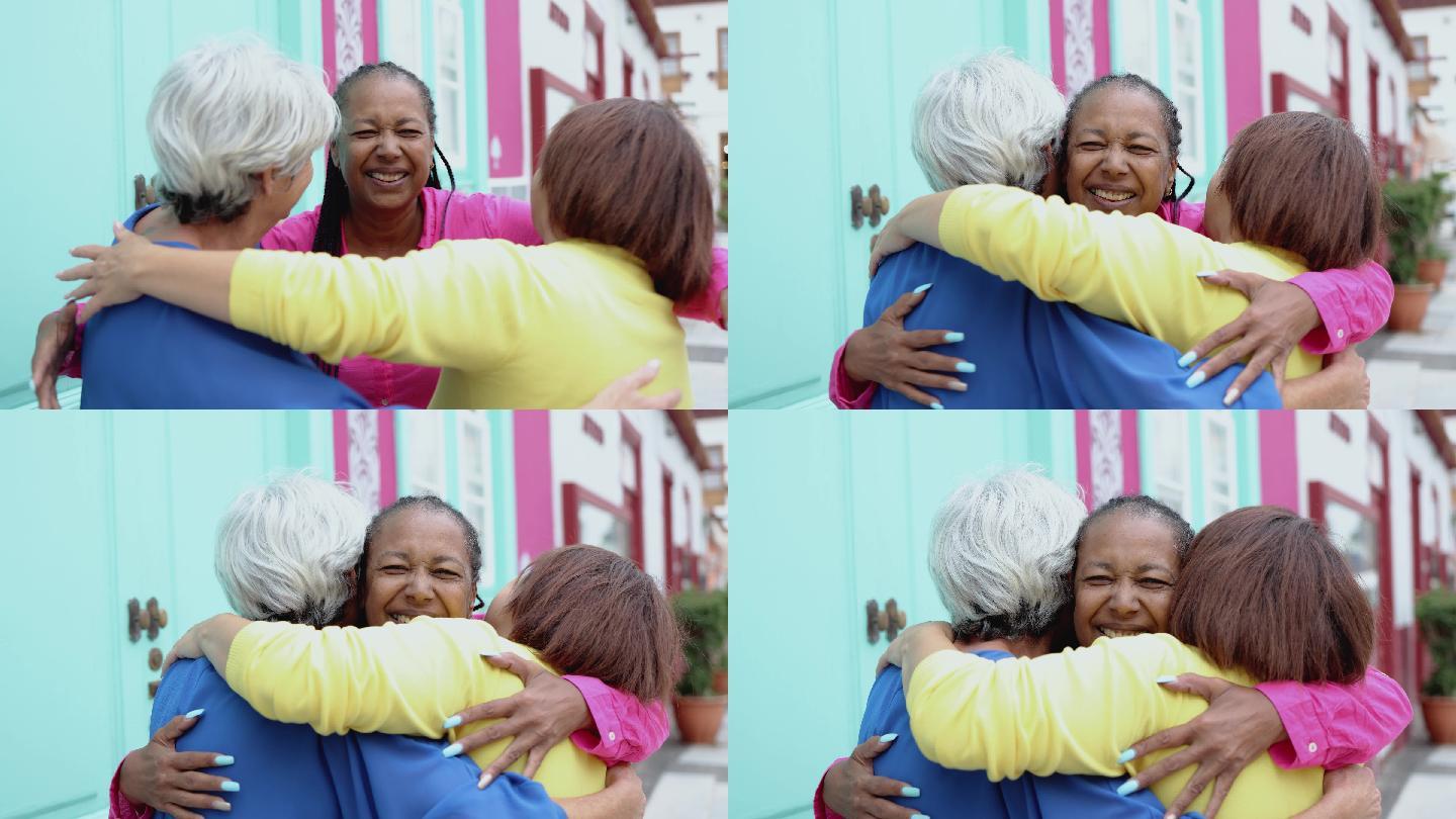 老年女性在城市户外一起享受拥抱