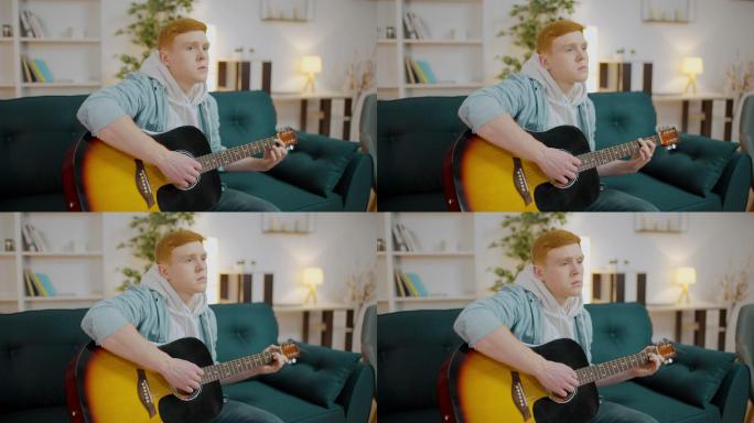 红头发年轻人在沙发上弹吉他
