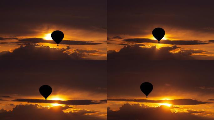 在美丽的日落天空中乘气球飞行