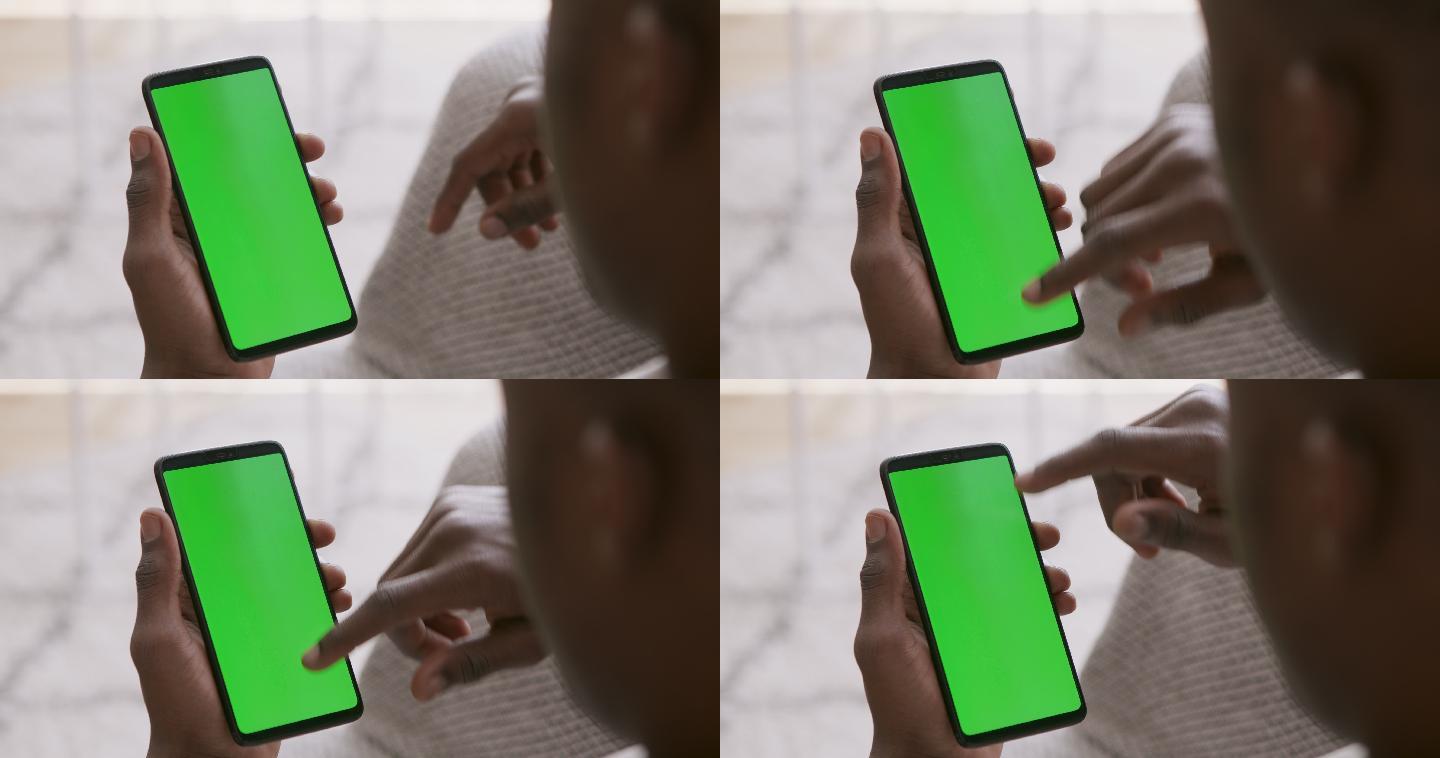 男子用绿屏浏览手机