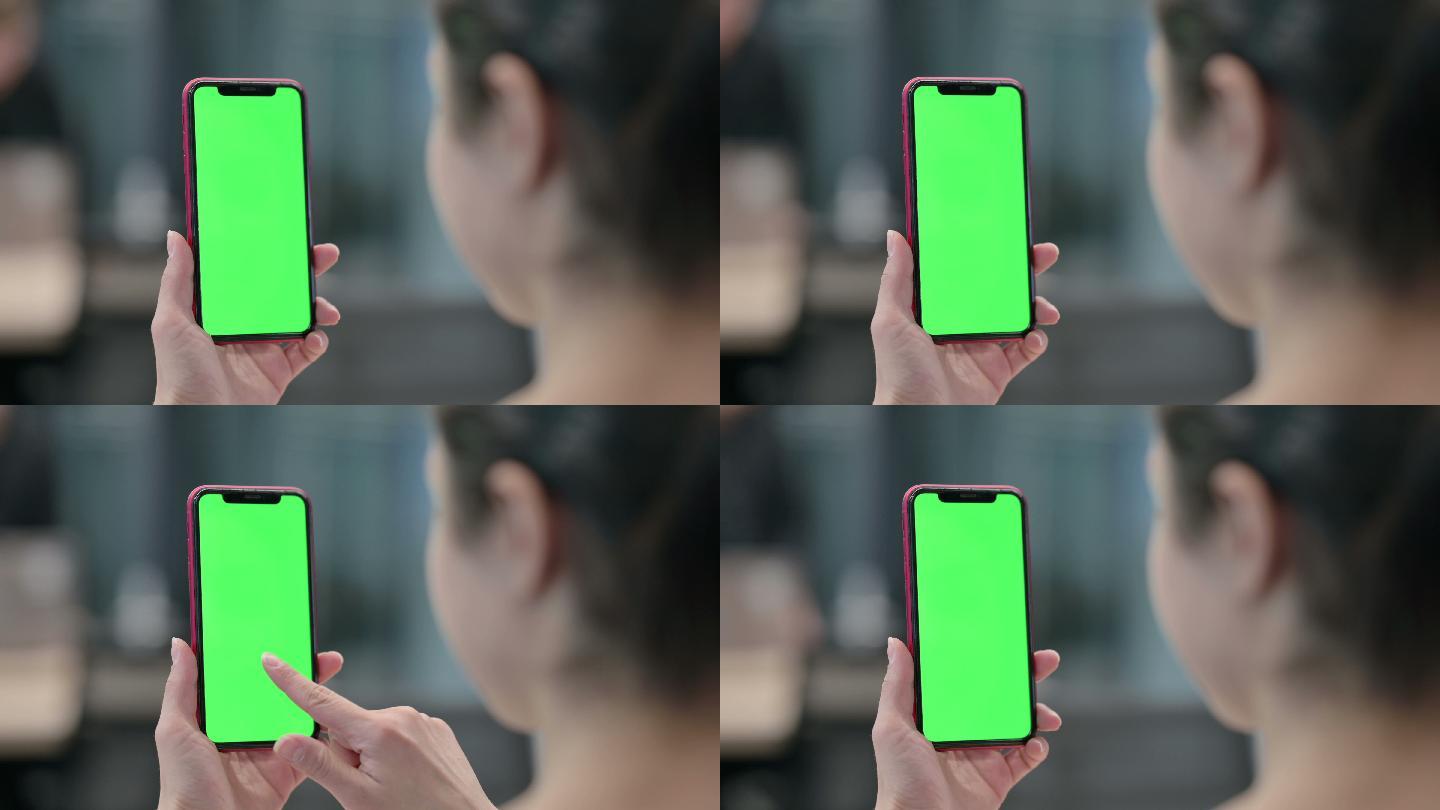 女性使用带有绿色屏幕的智能手机