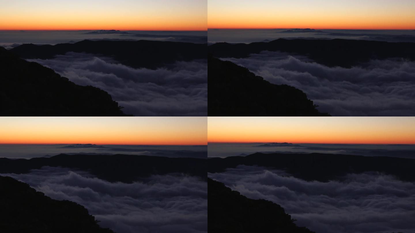 日落时山顶上雾气笼罩的壮丽景色。