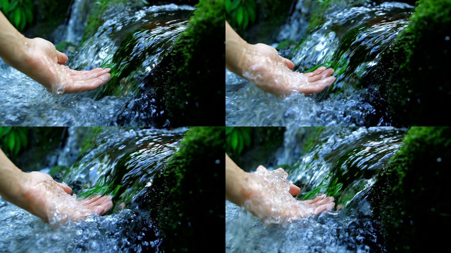 触摸清澈的溪水自然液体概念