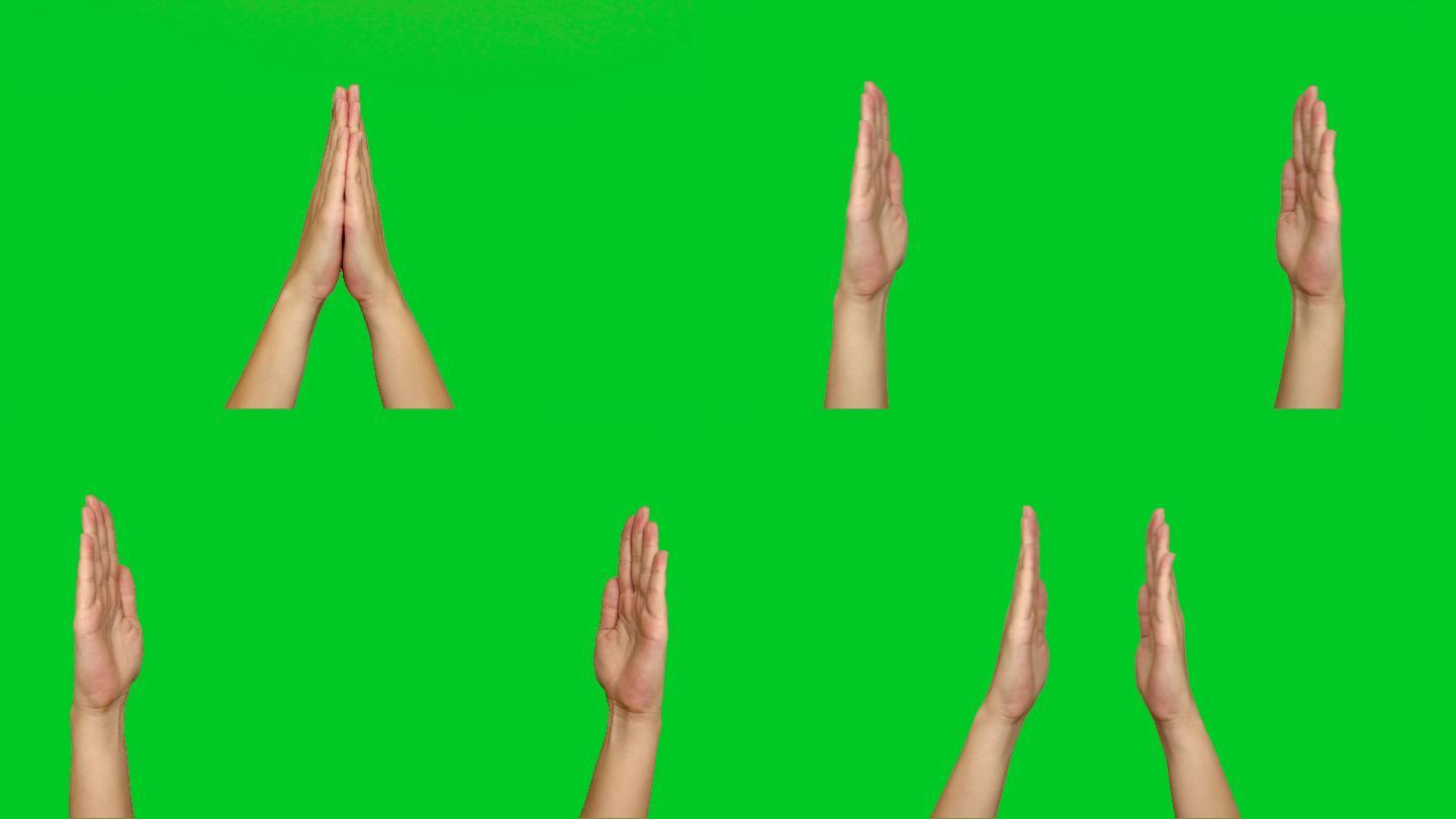 双手在绿色屏幕上张开。