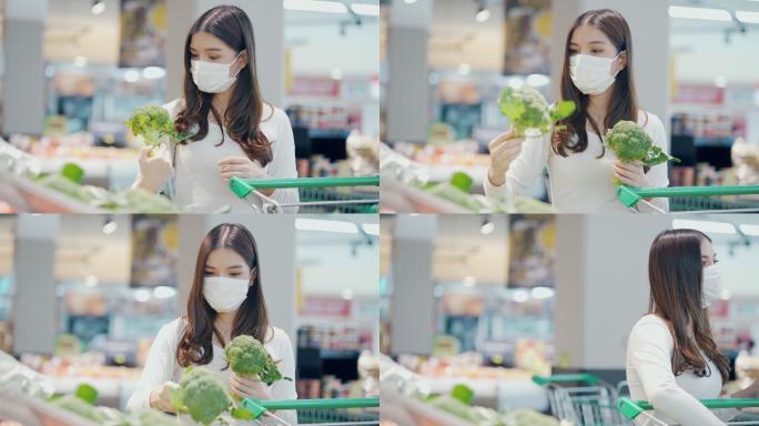 女人在超市挑选蔬菜