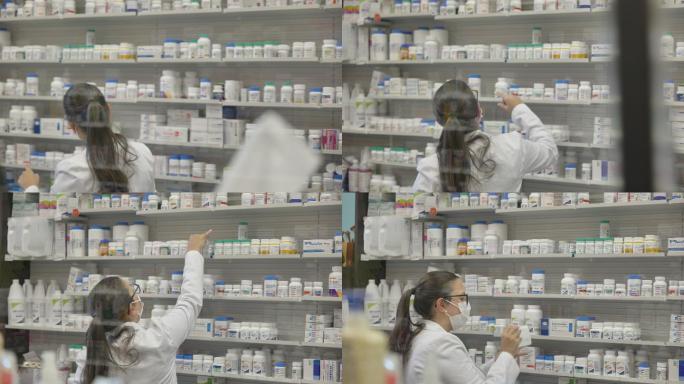 女药剂师戴着防护口罩整理货架上的药瓶。