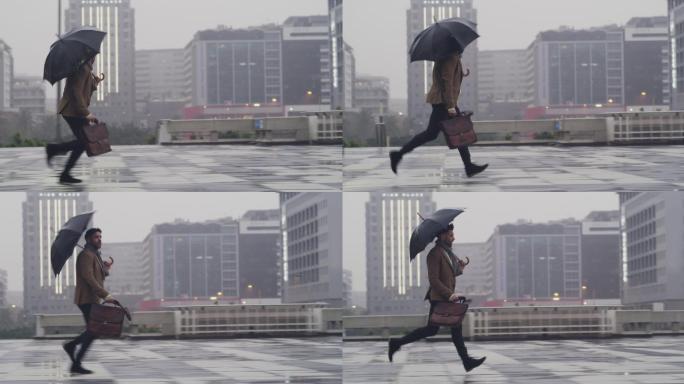 商人撑着雨伞，在城市户外雨中奔跑