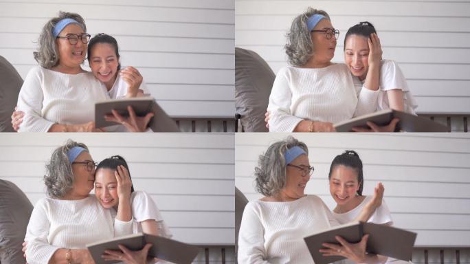亚洲老妇人和女儿在家看书