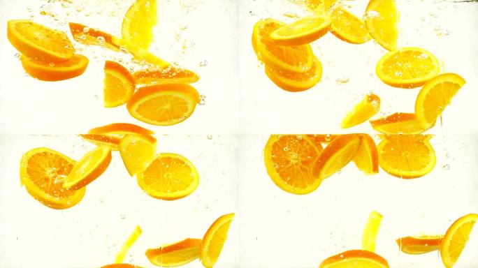 多汁的橙子片落入水中