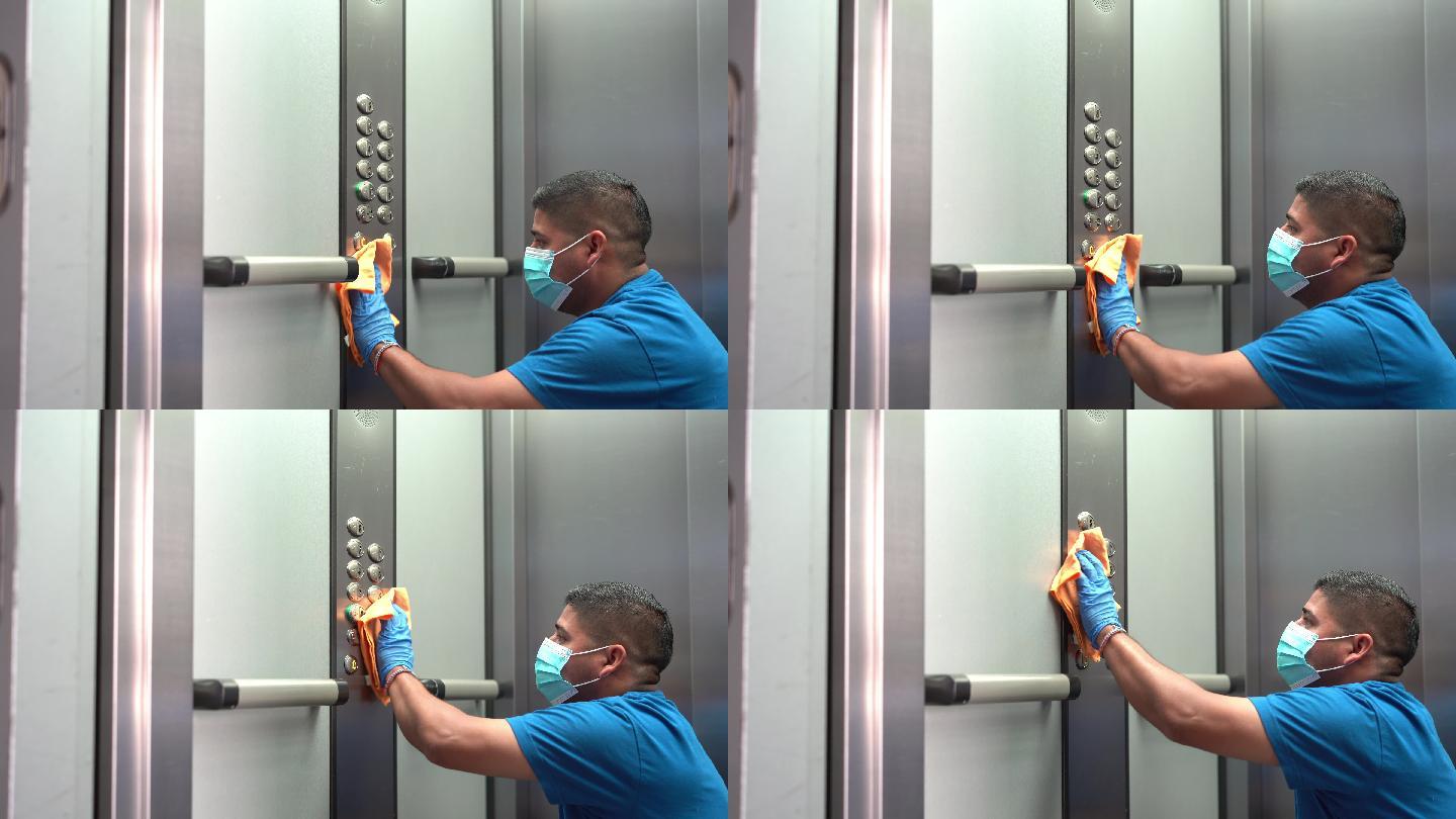 清洁专业人员彻底消毒电梯按钮