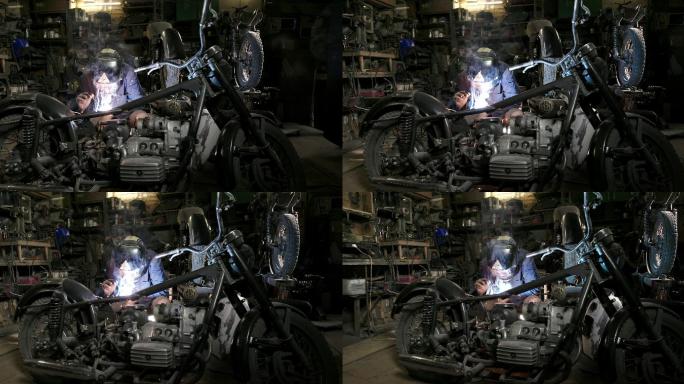 摩托车车间工作的经男子的特写镜头