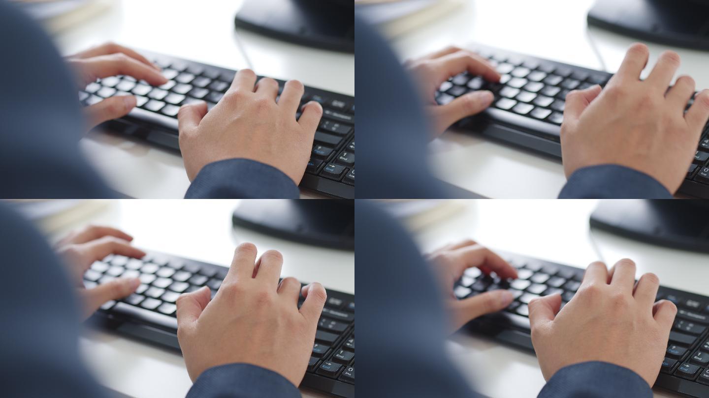 商务人士在电脑桌面上用键盘打字