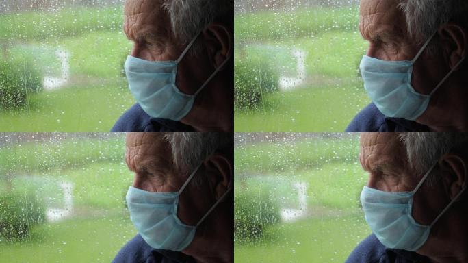 悲伤老人望着窗外的街道