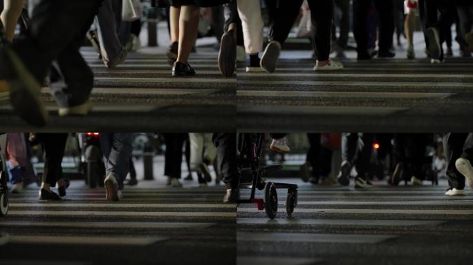 夜晚行人穿过人行道脚步特写2
