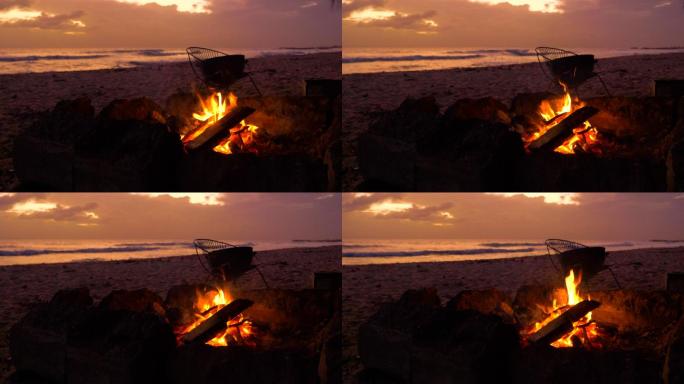 沙滩上燃烧着小火傍晚沙滩篝火露营海边海风