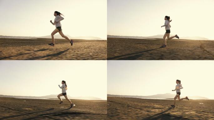 女跑步者在海滩上进行快速跑步训练