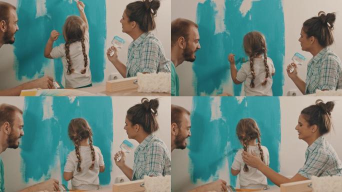 粉刷墙壁一家三口粉刷墙壁蓝色油漆