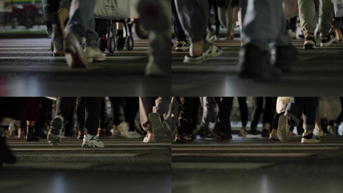 夜晚行人穿过人行道脚步特写1