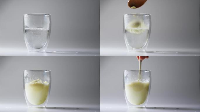 玻璃杯倒水冲泡成人婴幼儿营养绿色牛奶粉