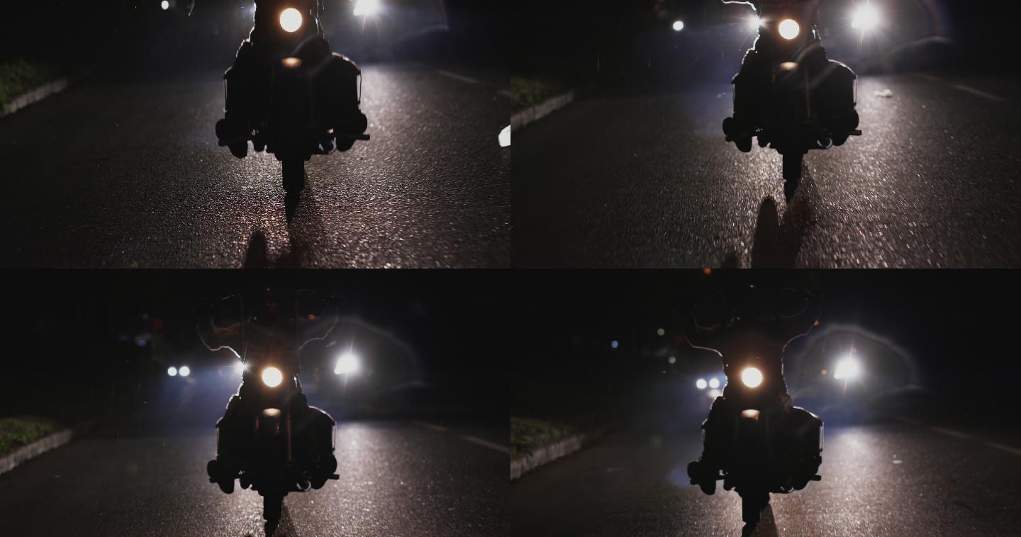 夜间骑摩托车的匿名男子