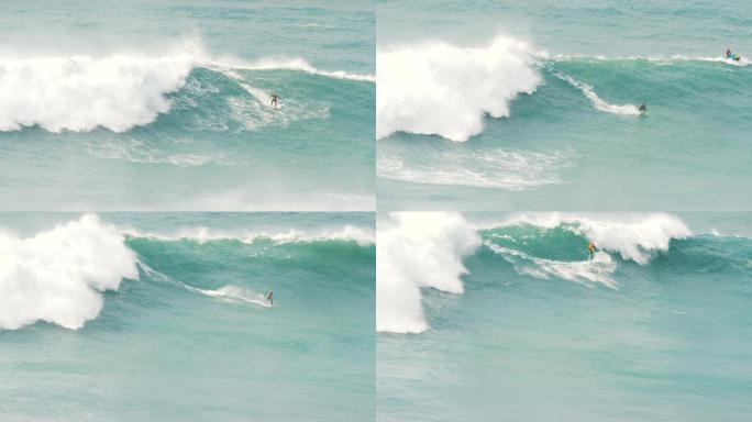 冲浪者在巨浪上冲浪