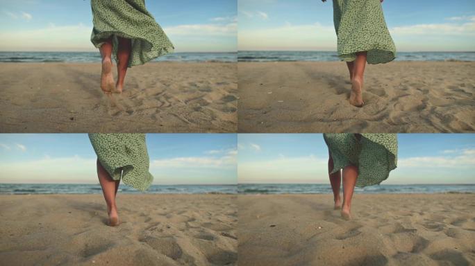 清晨，一个女人赤脚在海滩上慢动作行走