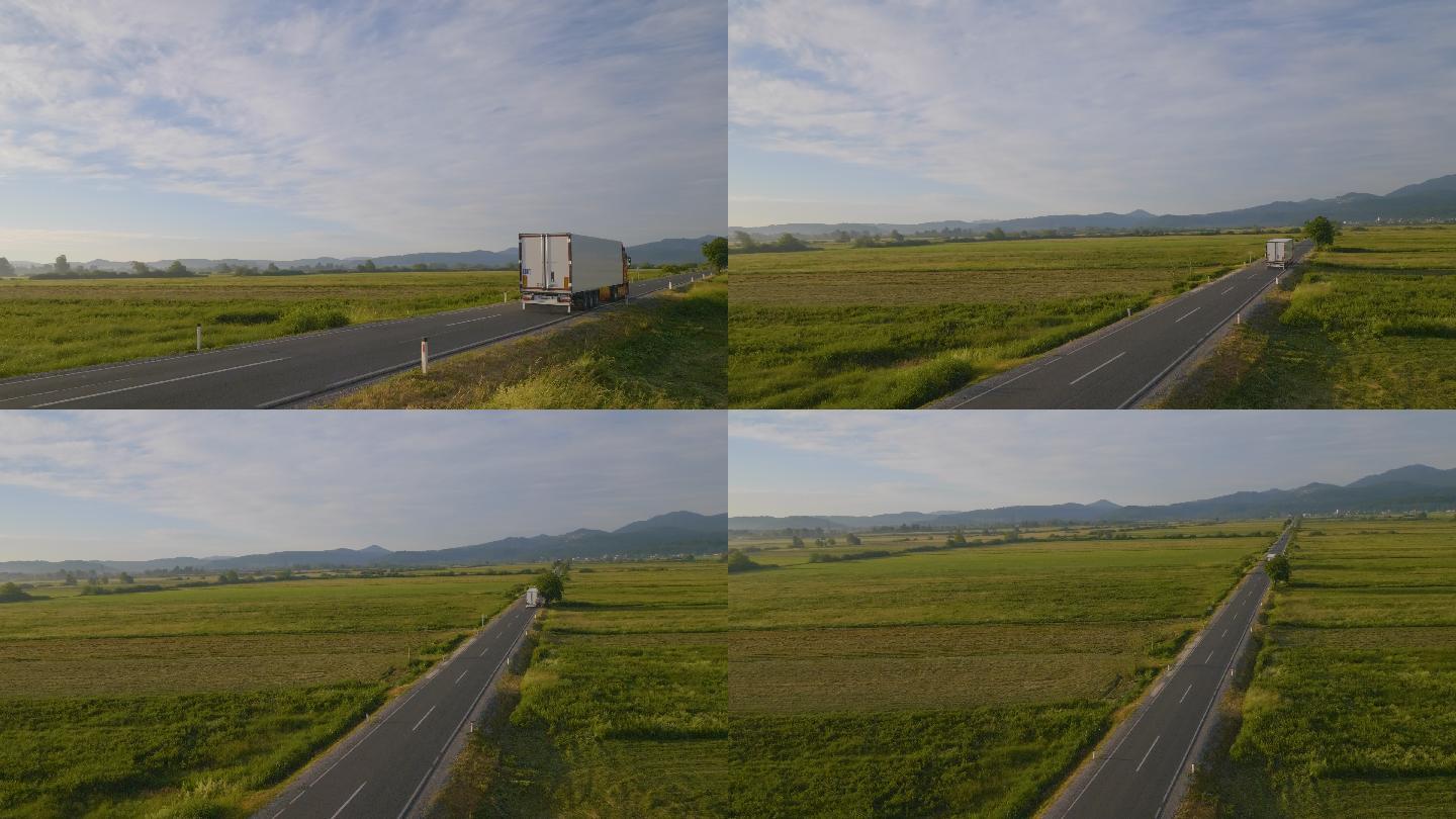 卡车行驶在公路上货车快递乡间小路农村田野