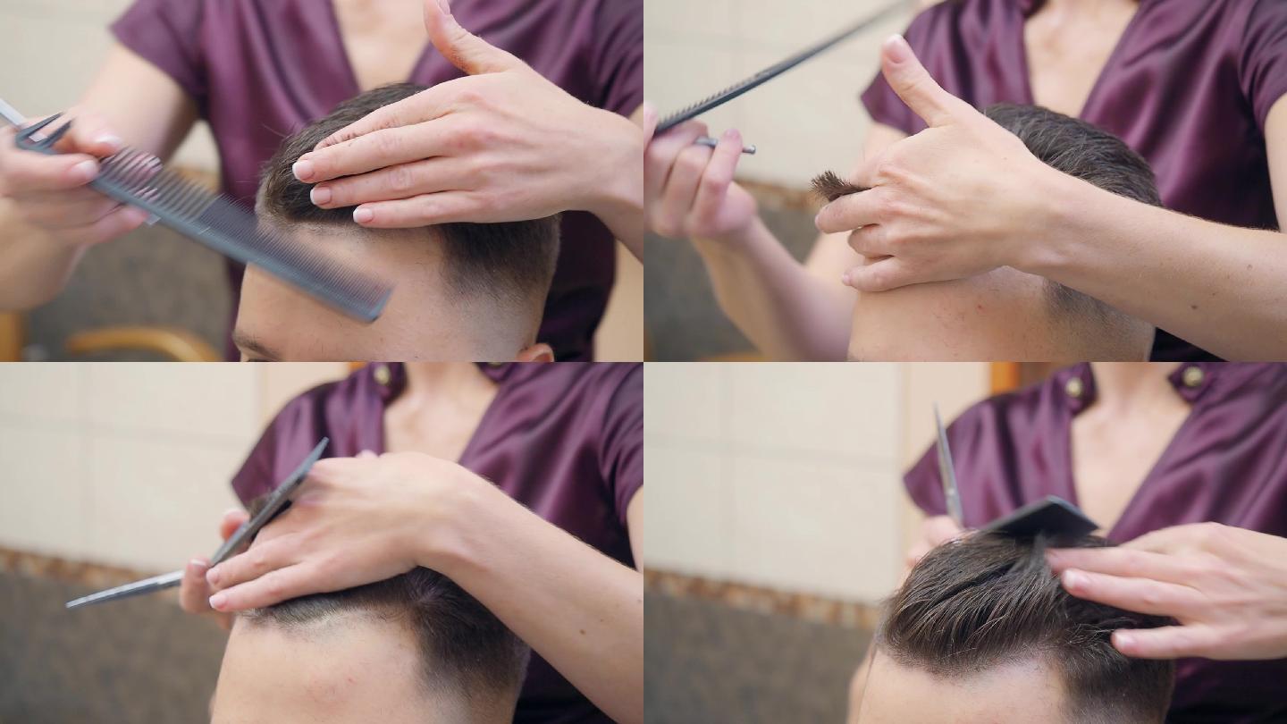 发型师用梳子和剪刀剪头发的近景。