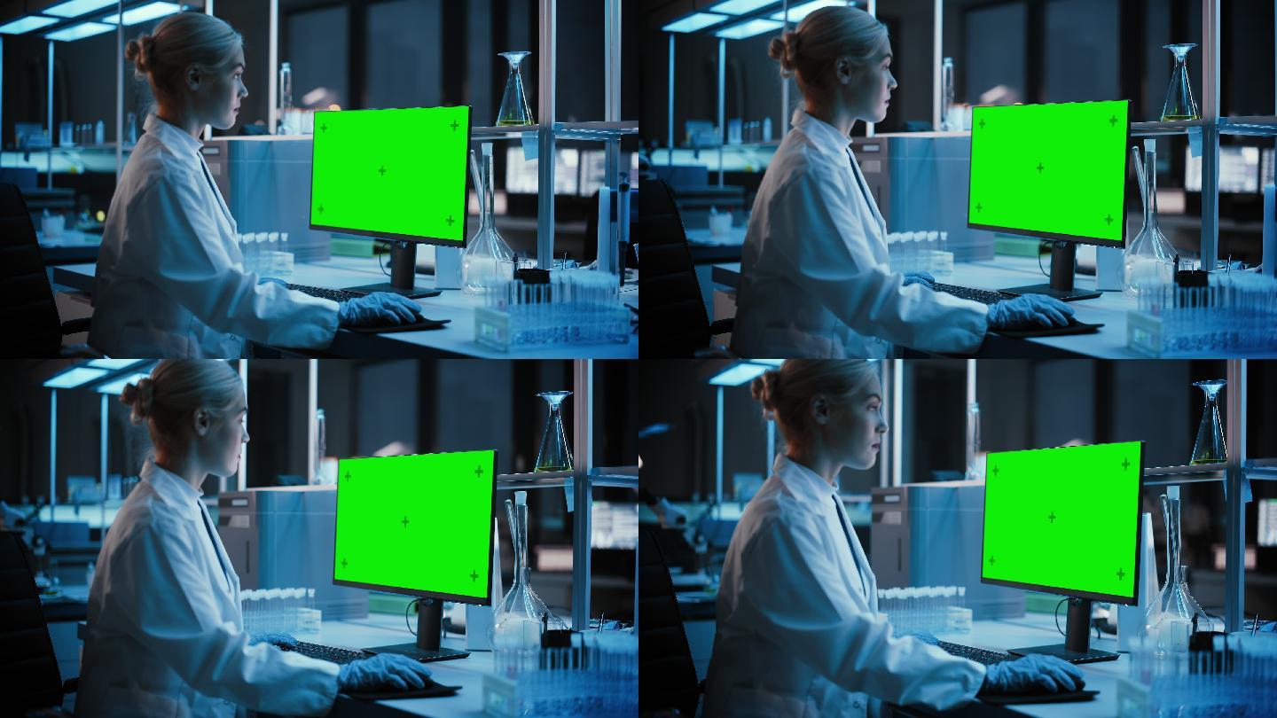 女科学家用绿色屏幕在电脑工作