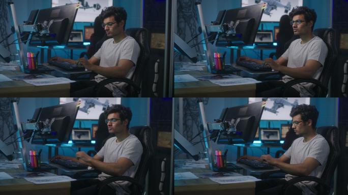 一名视频游戏开发商在办公桌旁工作的中景