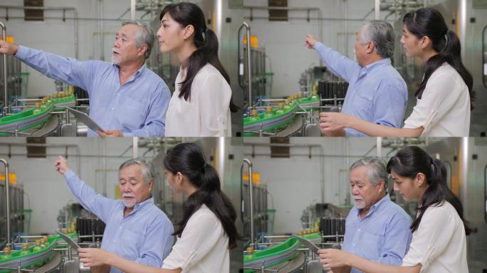 工厂经理和一位女性助理在瓶子生产线讨论