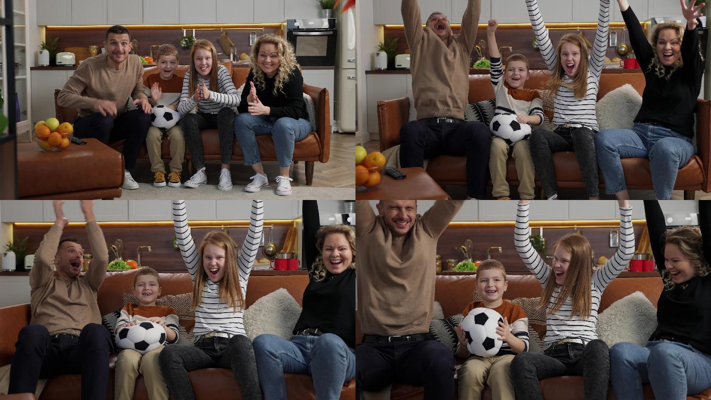 快乐的家庭在电视上看足球比赛
