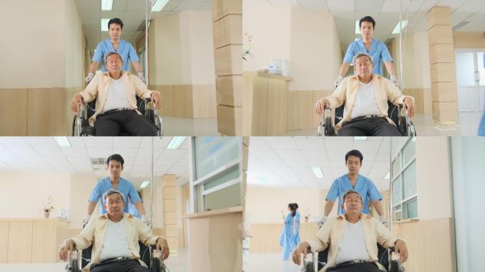 护士在医院走廊中移动轮椅上的老年患者。