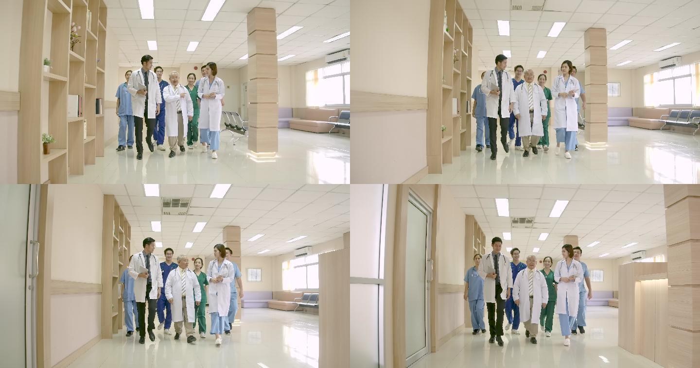 一群男女医生在医院走廊里谈论