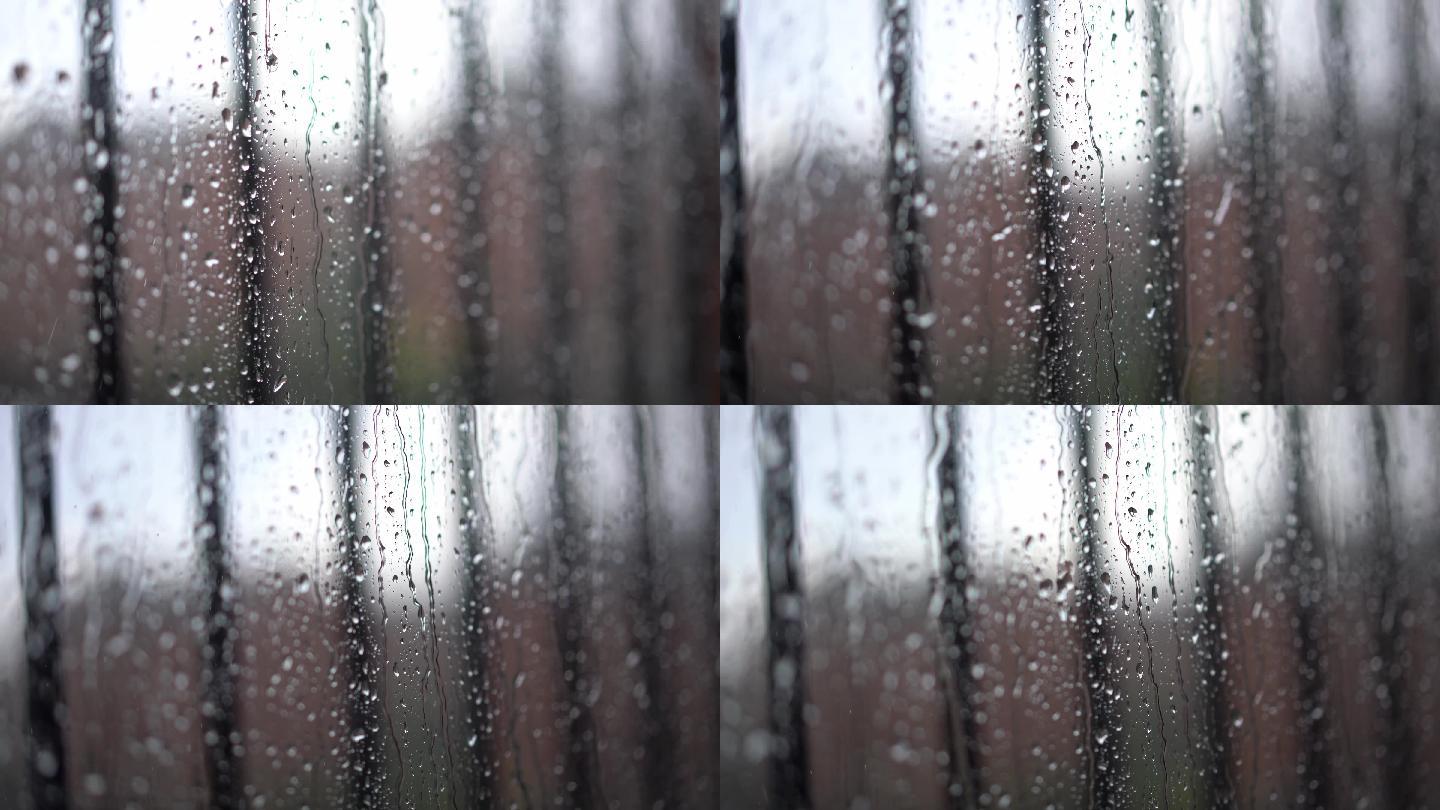透过玻璃看雨的景象。