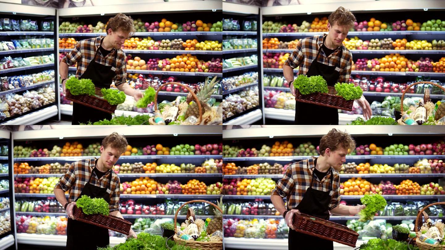 男性店员在超市的一个吧台上摆放新鲜蔬菜