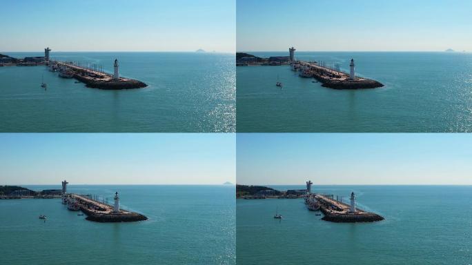 航拍俯瞰青岛海滨浮山湾奥帆中心情人坝灯塔