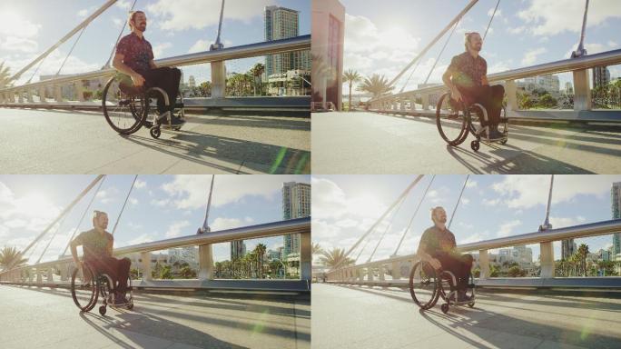 年轻快乐的残疾人推着轮椅过桥