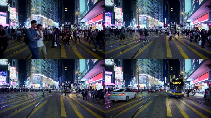 人们在晚上行驶在香港的人行道