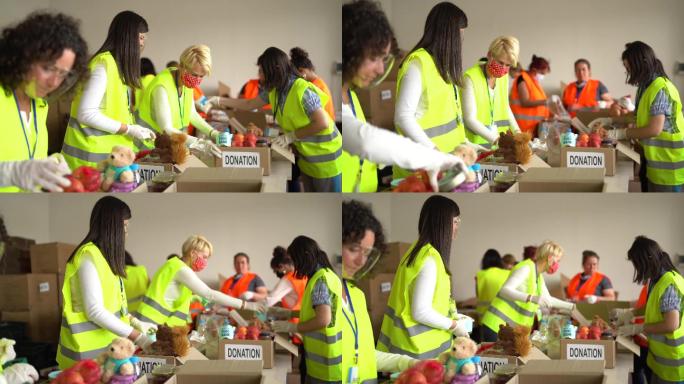 志愿者在仓库里收集食物捐赠
